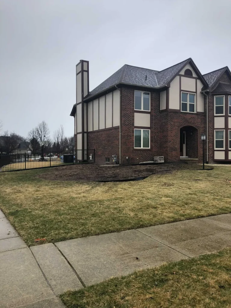 Front yard of a brick home after tree removal