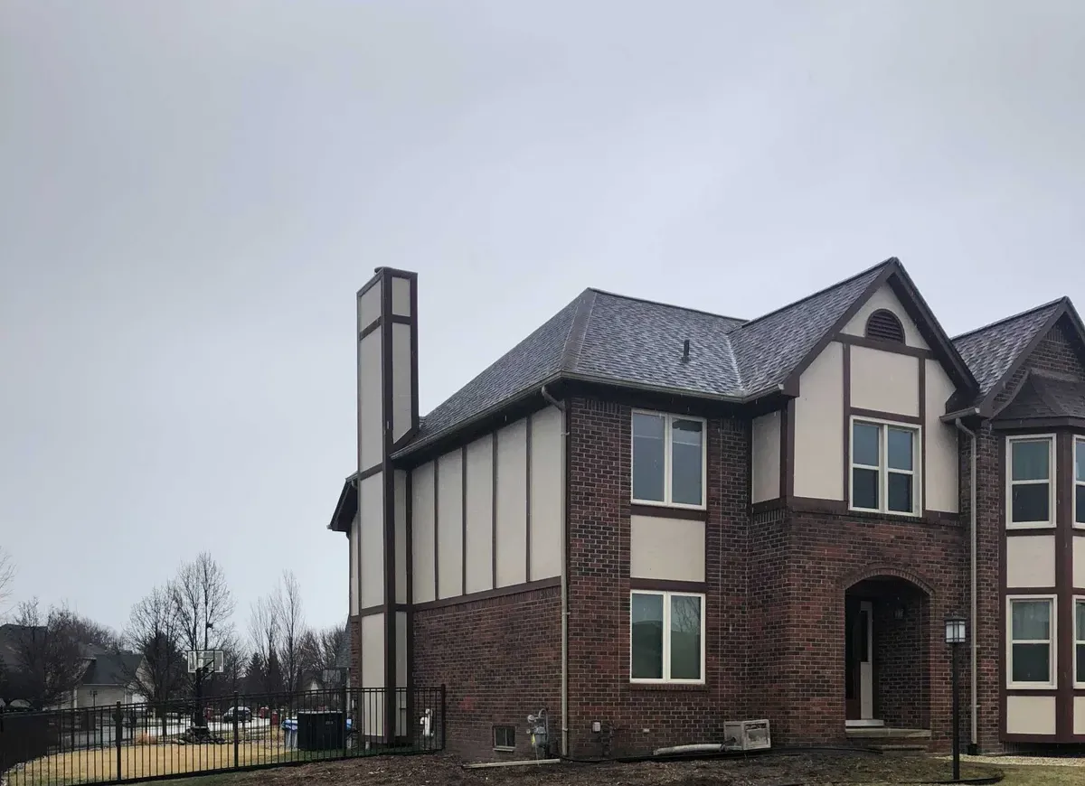 Front yard of a brick home after tree removal